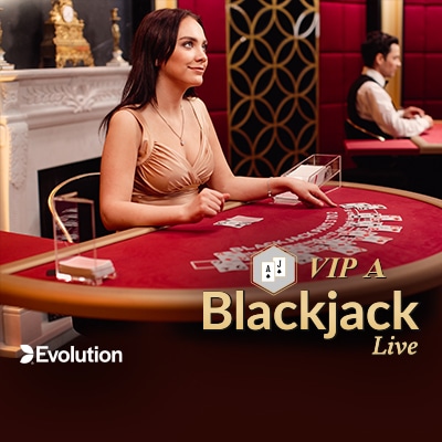 Live blackjack dealer seated behind a blackjack table